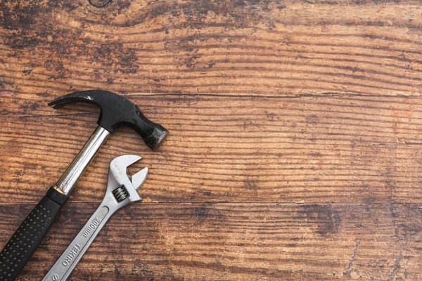 Background photo of tools resting on a workbench